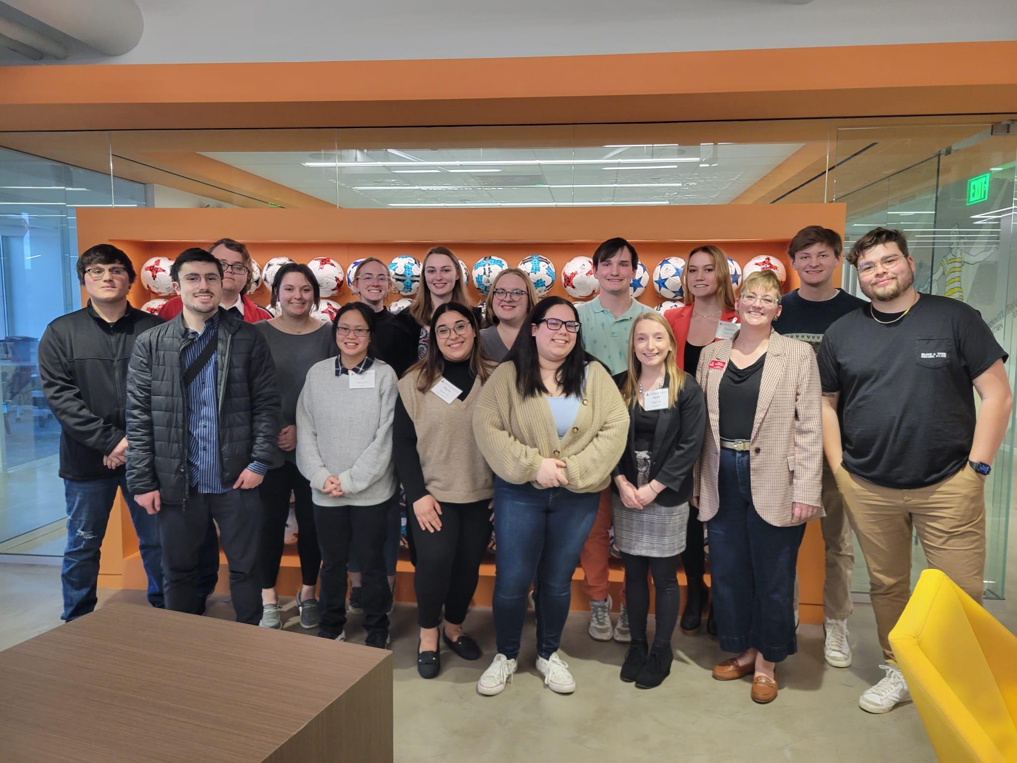Students and trip staff meet with a young alumnus. Photo courtesy of Any Gerretsen.