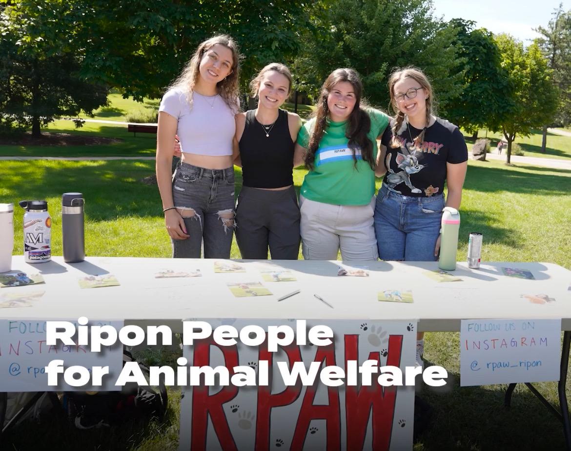 Members of RPAW pose behind their table at the Fall activities fair. Photo Courtesy of RC Student Life.