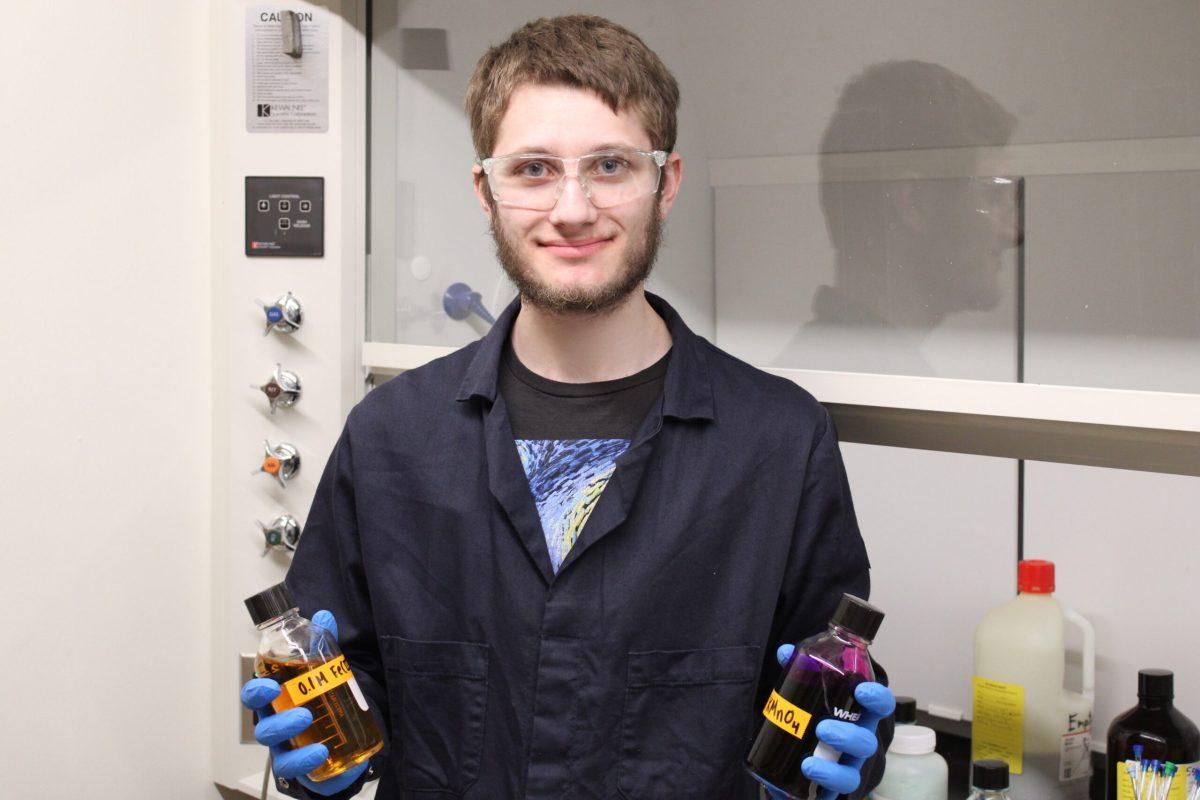 Jacob Abraham, senior, poses while performing his daily tasks in the Franzen Science Center. Photo courtesy of Ryder Ebbe. 