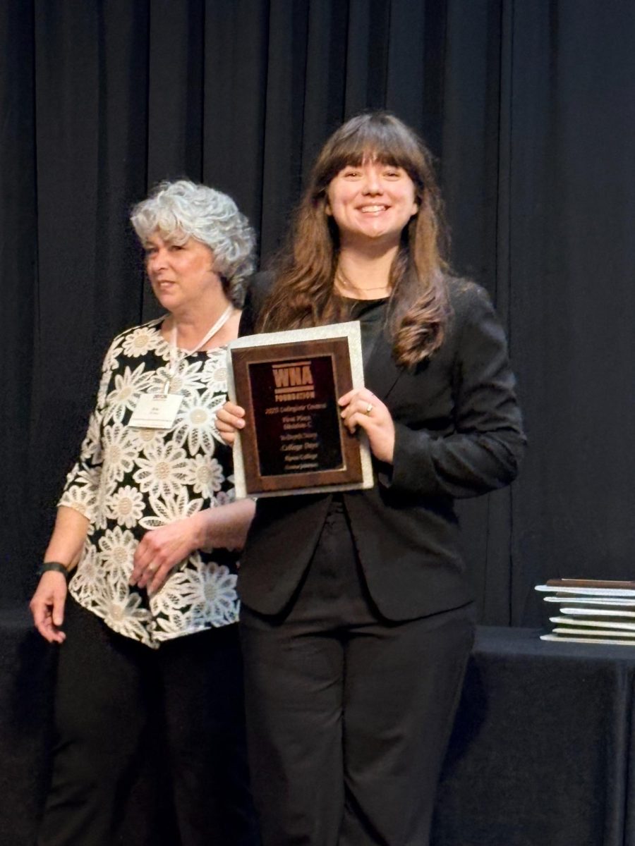 Emma Johnson receives an award on behalf of the College Days at the WNA Conference in March 2026. 
