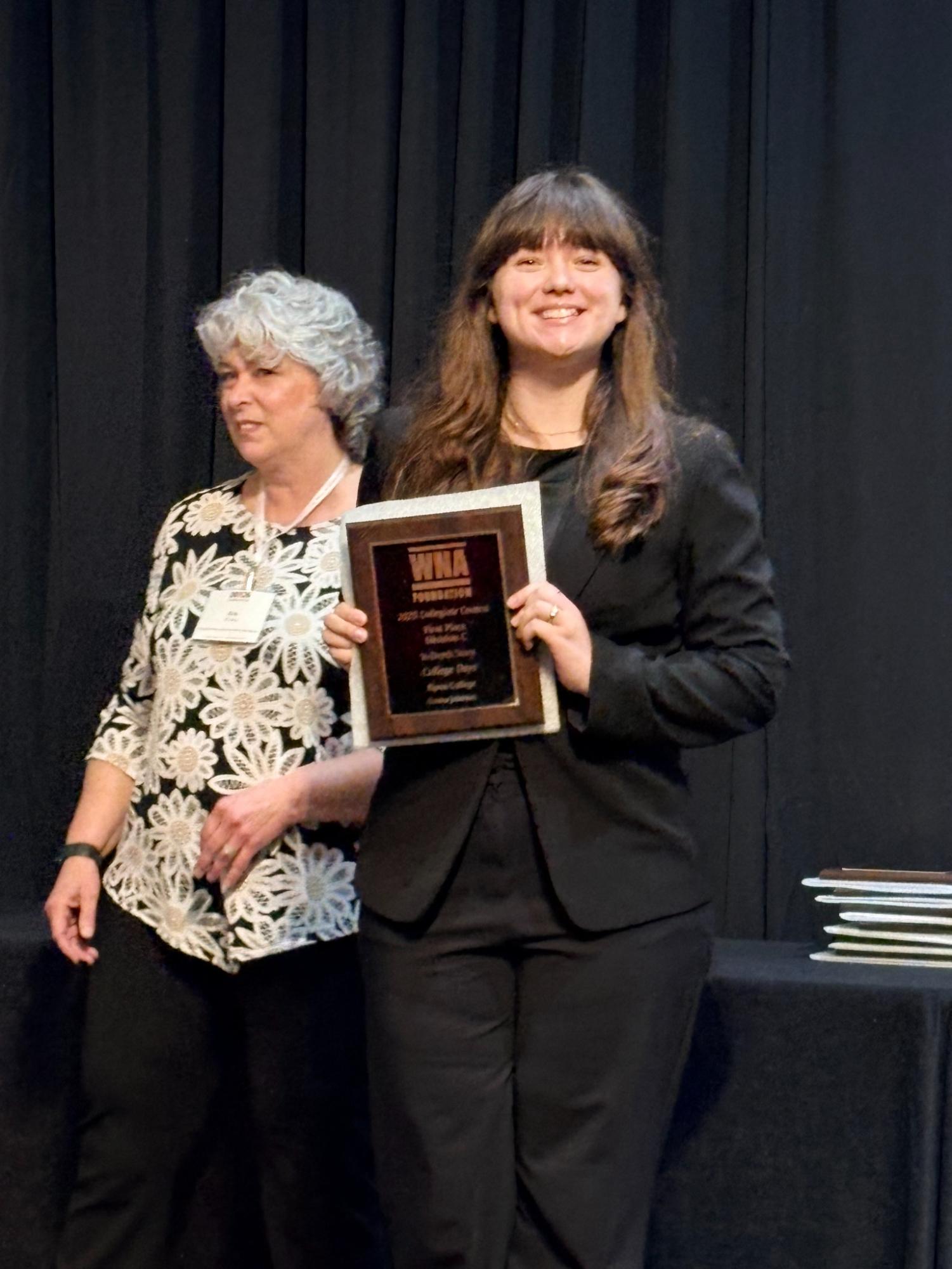 Emma Johnson receives an award on behalf of the College Days at the WNA Conference in March 2026. 